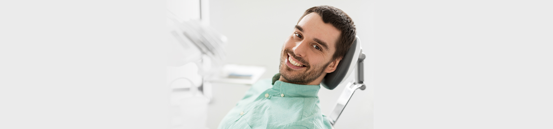 A sleek dental clinic interior showcasing a dental chair, equipment, and a calming environment for cosmetic procedures at New Smile Dentistry.