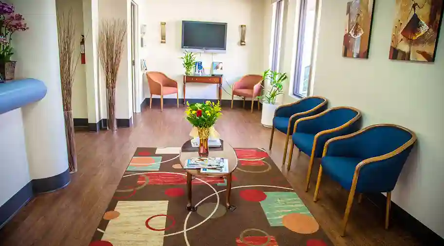 A bright dental office with modern equipment, showcasing a welcoming atmosphere for patients seeking dental care at New Smile Dentistry